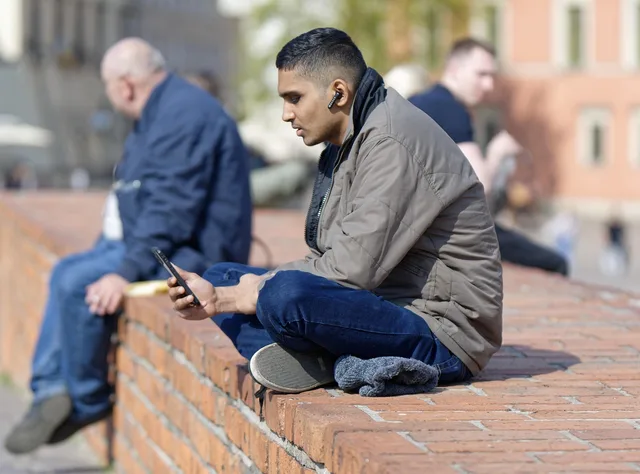 man, smart phone, outdoors, phone call, city, everyday life. Asking for a next step proportionate to the prospect's interest