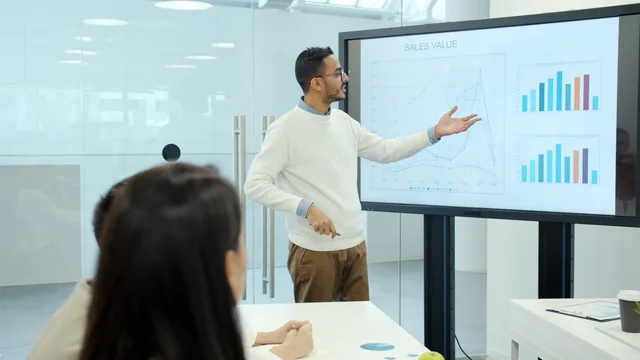 Professional presentation with graphs in a modern office environment. Outbound follow-up sequences